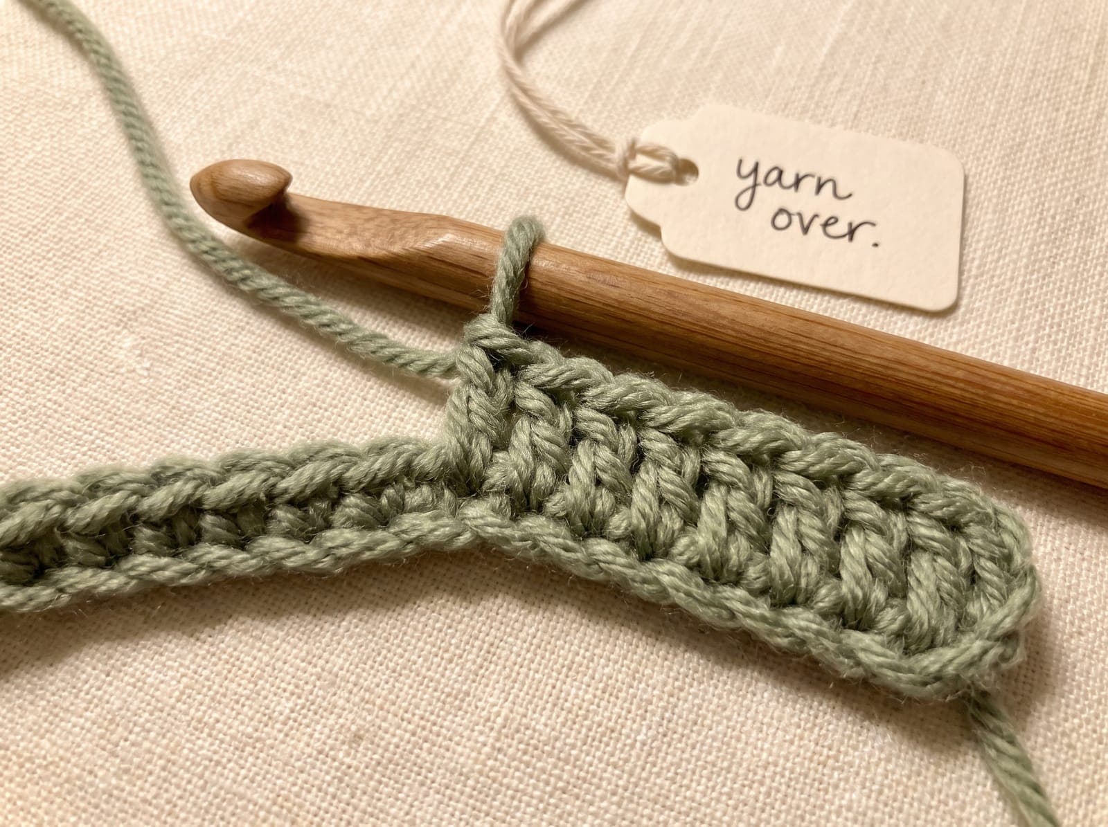 A yarn over on the hook before inserting, the first step of double crochet.