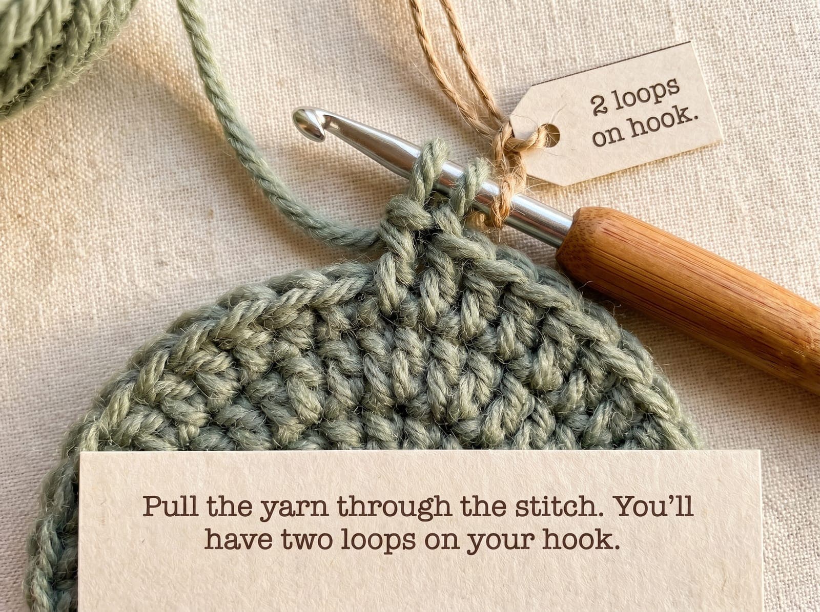 Pulling up a loop so there are two loops on the crochet hook.