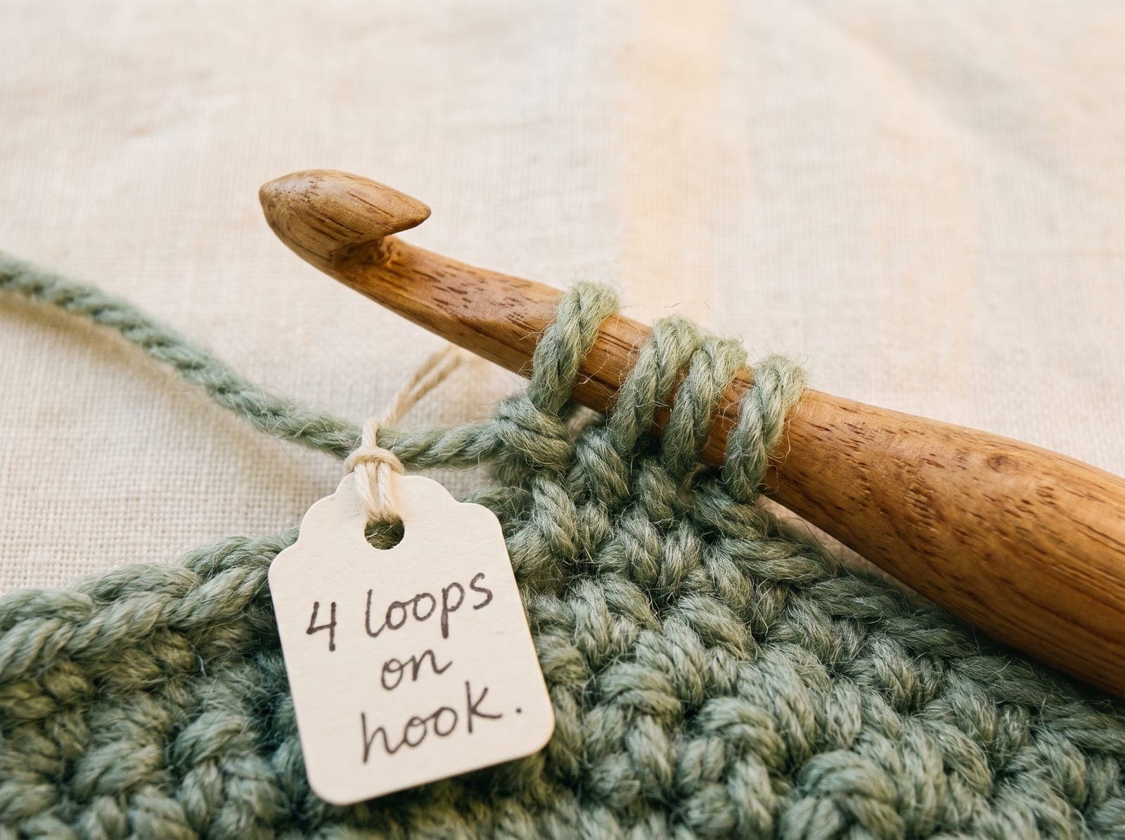 Four loops on a crochet hook after pulling up a loop for treble crochet.